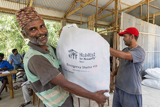 Khagendra with emergency shelter kit in Nepal
