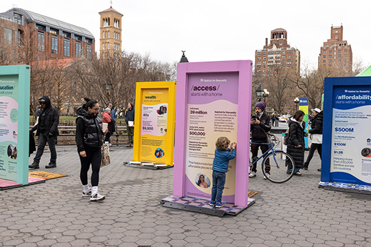 People interacting with pop-up doors in New York City