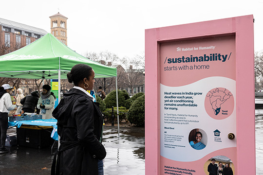 Member of public looking at messaging on a pop-up door in NY