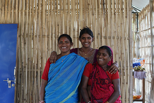 Aarti and her family at their bamboo home in Nepal