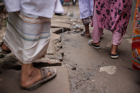 Close-up of feet of residents of Bangladesh informal settlem