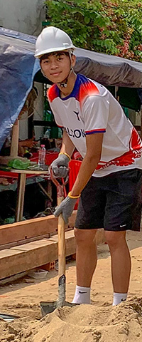 Youth volunteer Jerhuy Shen-Puoy at a build site in Cambodia